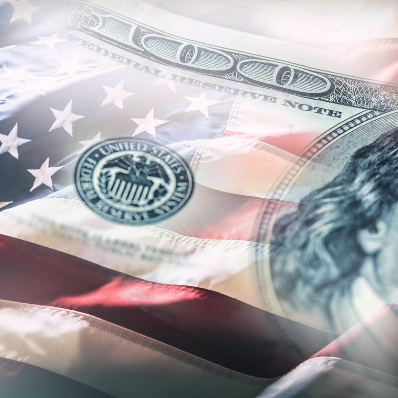 United States flag overlaid with U.S. dollar currency symbolizing bond financing expansion
